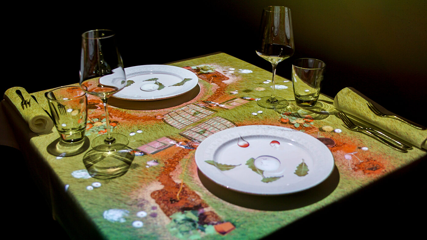 Table set over the 3D garden projection